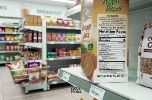 Close-up of a juice carton and a granola bag showing labelling on a supermarket shelf.