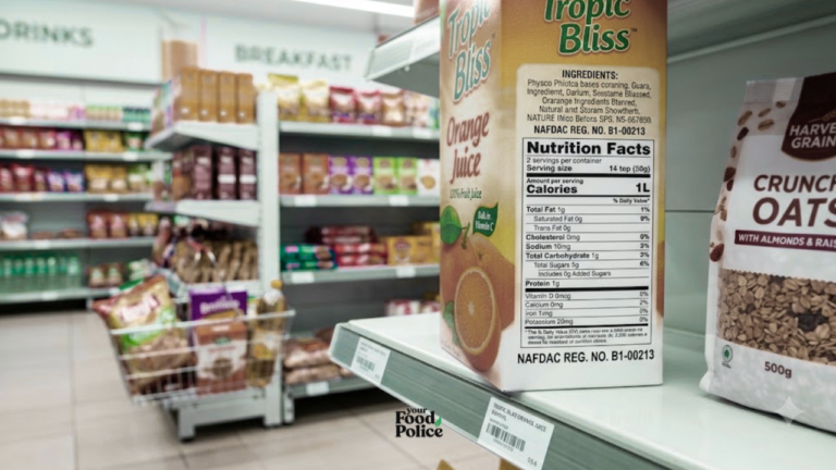 Close-up of a juice carton and a granola bag showing labelling on a supermarket shelf.